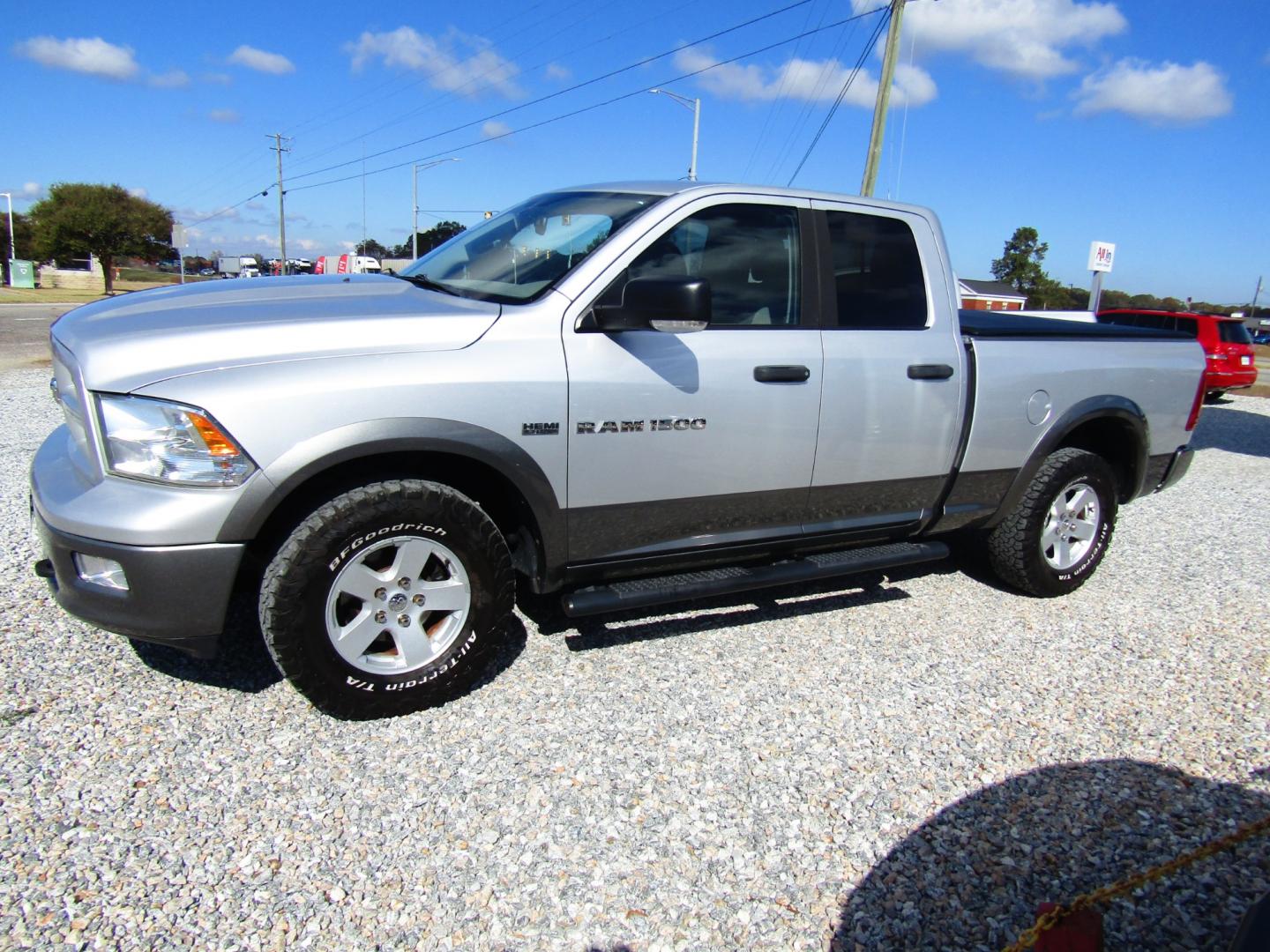 2011 Silver Dodge Ram 1500 Sport Quad Cab 4WD (1D7RV1GT9BS) with an 5.7L V8 OHV 16V engine, Automatic transmission, located at 15016 S Hwy 231, Midland City, AL, 36350, (334) 983-3001, 31.306210, -85.495277 - Photo#1